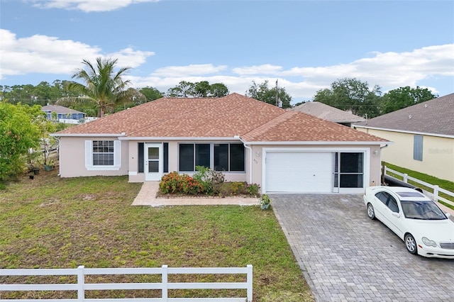 497 Lafayette St SW, Palm Bay, FL 32908 - ranch-style house with an attached garage, driveway, stucco siding, and a shingled roof
