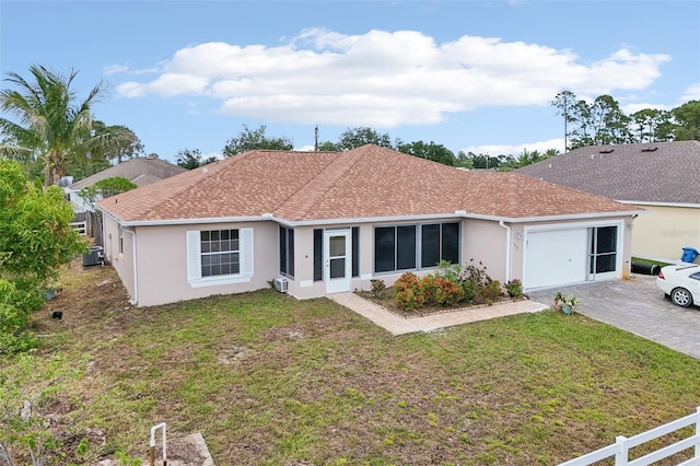 497 Lafayette St SW, Palm Bay, FL 32908 - single story home featuring stucco siding, a garage, driveway, and a front yard