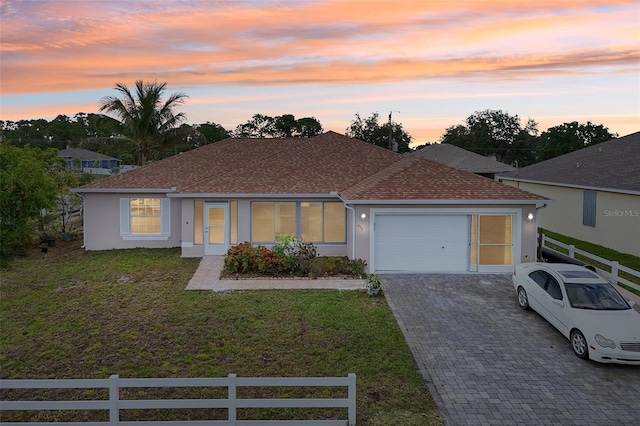 497 Lafayette St SW, Palm Bay, FL 32908 - view of front of house with driveway, an attached garage, stucco siding, and a shingled roof