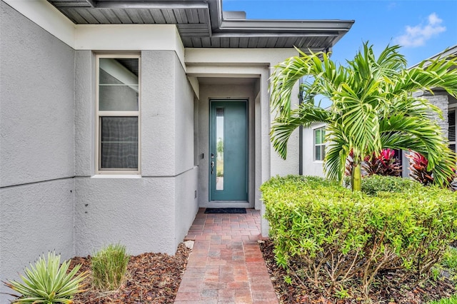 3149 Songbird Cir, Harmony, FL 34773 - view of exterior entry featuring stucco siding