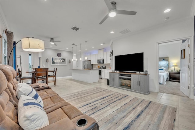 3149 Songbird Cir, Harmony, FL 34773 - living room featuring a ceiling fan, light tile patterned flooring, baseboards, crown molding, and recessed lighting