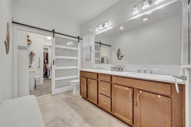 3149 Songbird Cir, Harmony, FL 34773 - full bath featuring toilet, double vanity, and a walk in closet