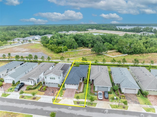 3149 Songbird Cir, Harmony, FL 34773 - aerial view of residential area with property boundaries highlighted and a large body of water