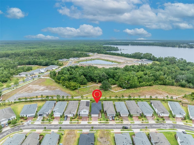 3149 Songbird Cir, Harmony, FL 34773 - view of property location with a large body of water, a forest, and nearby suburban area
