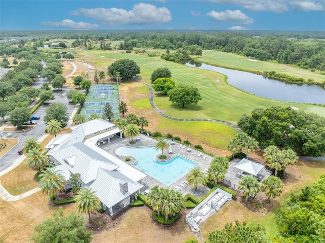 3149 Songbird Cir, Harmony, FL 34773 - drone / aerial view of a pool area, a nearby body of water, and a local golf course
