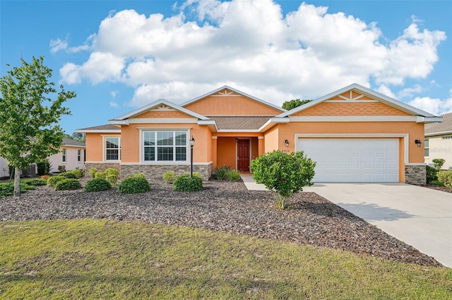 8932 SW 101st Cir, Ocala, FL 34481 - view of front facade with stone siding, concrete driveway, stucco siding, a garage, and a front yard