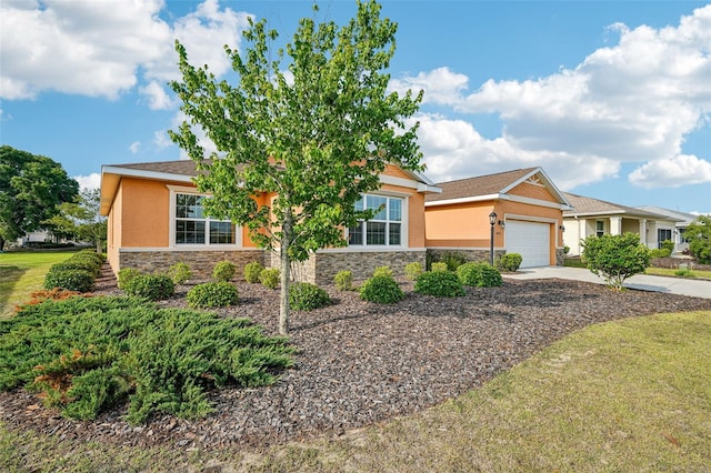 8932 SW 101st Cir, Ocala, FL 34481 - view of front of property with stone siding, stucco siding, a garage, driveway, and a front yard