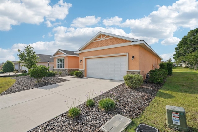 8932 SW 101st Cir, Ocala, FL 34481 - view of front of home with stone siding, stucco siding, concrete driveway, and an attached garage