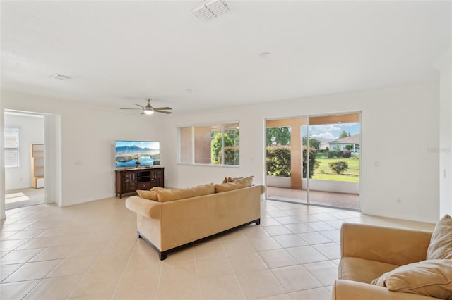 8932 SW 101st Cir, Ocala, FL 34481 - living room with light tile patterned floors and ceiling fan