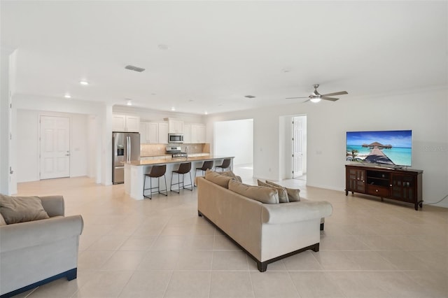 8932 SW 101st Cir, Ocala, FL 34481 - living room featuring light tile patterned flooring, ceiling fan, and recessed lighting