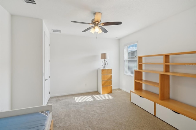 8932 SW 101st Cir, Ocala, FL 34481 - unfurnished bedroom with carpet flooring, baseboards, and a ceiling fan