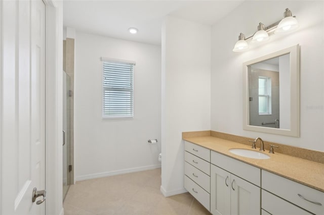 8932 SW 101st Cir, Ocala, FL 34481 - bathroom with toilet, vanity, tile patterned floors, a shower with shower door, and baseboards