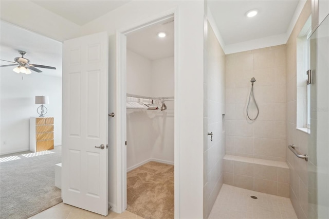 8932 SW 101st Cir, Ocala, FL 34481 - bathroom with a tile shower, ceiling fan, a walk in closet, recessed lighting, and baseboards
