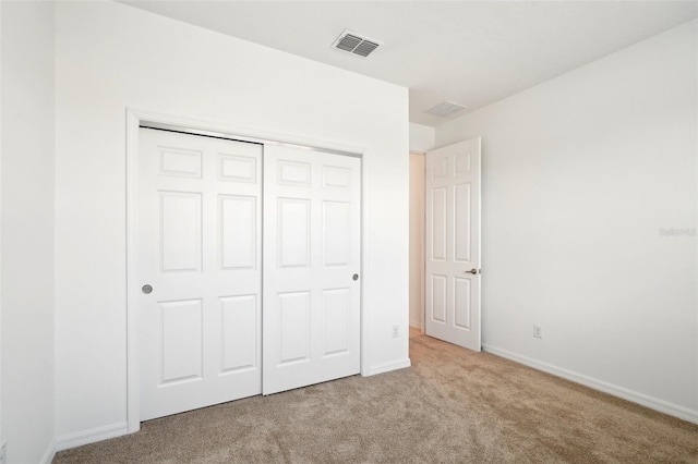 8932 SW 101st Cir, Ocala, FL 34481 - unfurnished bedroom featuring carpet flooring, a closet, and baseboards