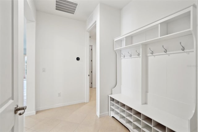 8932 SW 101st Cir, Ocala, FL 34481 - mudroom featuring baseboards and light tile patterned floors