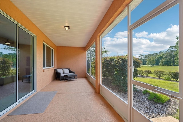8932 SW 101st Cir, Ocala, FL 34481 - unfurnished sunroom featuring carpet flooring and a textured wall