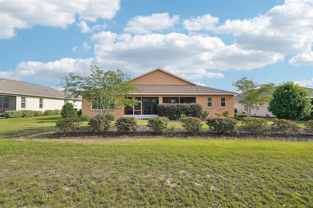 8932 SW 101st Cir, Ocala, FL 34481 - rear view of house with stucco siding and a yard
