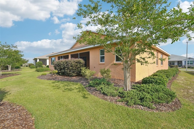 8932 SW 101st Cir, Ocala, FL 34481 - view of side of property with stucco siding and a yard