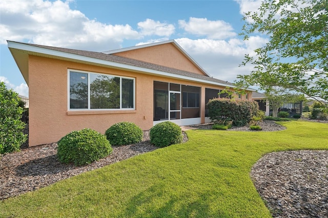 8932 SW 101st Cir, Ocala, FL 34481 - rear view of property featuring stucco siding and a lawn