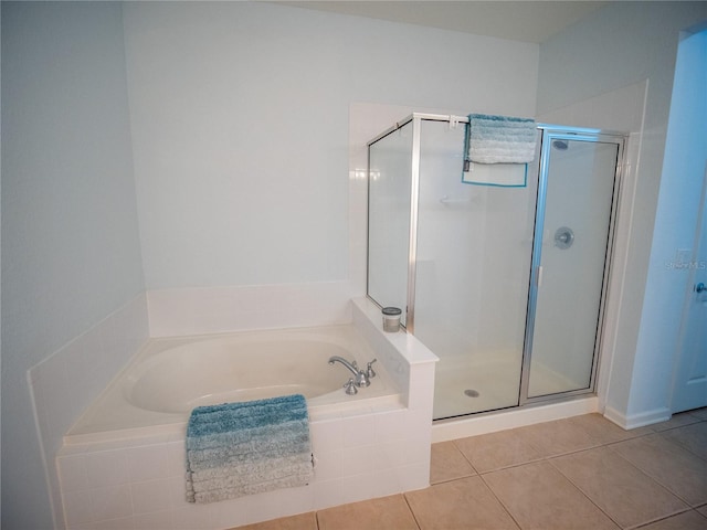 4816 Cayview Ave Unit 20111, Orlando, FL 32819 - bathroom featuring a shower stall, a garden tub, and tile patterned flooring