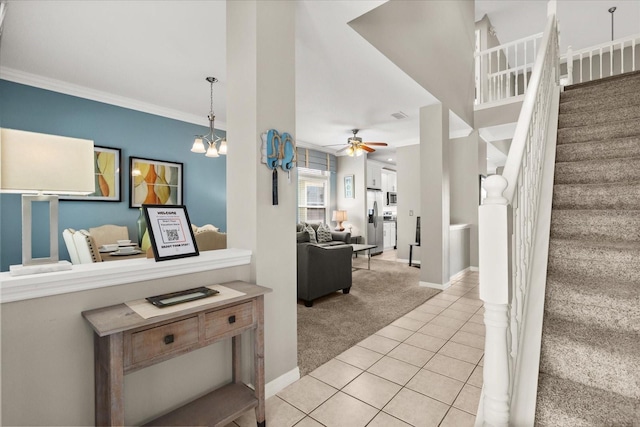 8522 Blue Horizon Ct, Kissimmee, FL 34747 - staircase featuring carpet flooring, tile patterned floors, ceiling fan, crown molding, and baseboards