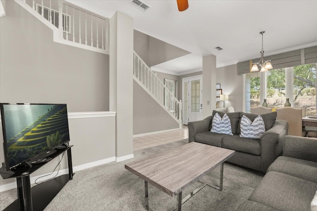 8522 Blue Horizon Ct, Kissimmee, FL 34747 - living room featuring stairway, baseboards, a chandelier, carpet, and ornamental molding