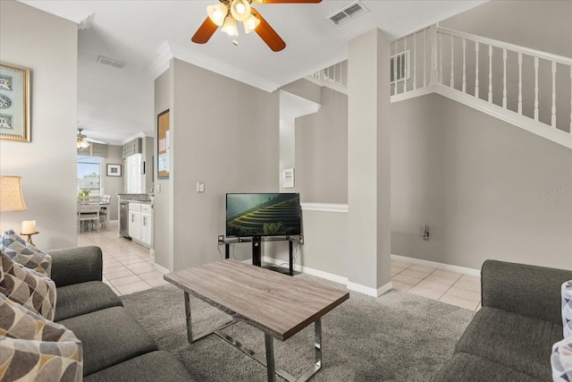 8522 Blue Horizon Ct, Kissimmee, FL 34747 - living area with a ceiling fan, light tile patterned floors, ornamental molding, and baseboards