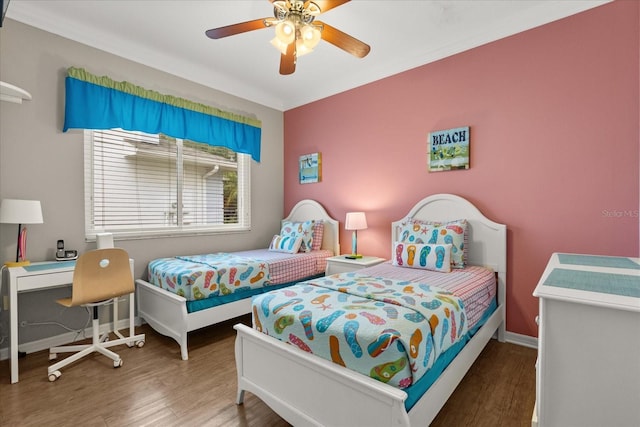 8522 Blue Horizon Ct, Kissimmee, FL 34747 - bedroom with wood finished floors, baseboards, and ceiling fan