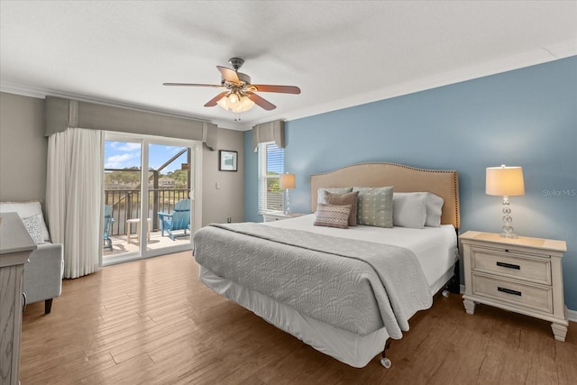 8522 Blue Horizon Ct, Kissimmee, FL 34747 - bedroom with access to outside, wood finished floors, and a ceiling fan