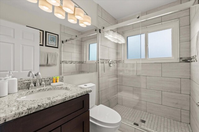 8522 Blue Horizon Ct, Kissimmee, FL 34747 - bathroom with toilet, a shower stall, and vanity
