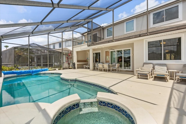 8522 Blue Horizon Ct, Kissimmee, FL 34747 - view of pool with a patio, a pool with connected hot tub, ceiling fan, outdoor dining space, and a lanai
