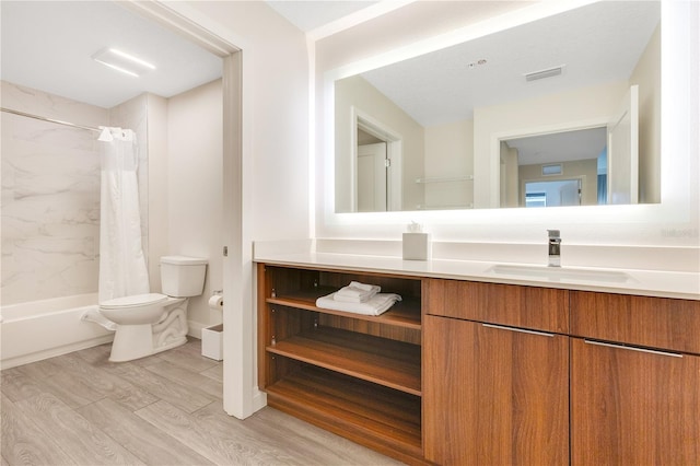 full bath featuring wood finished floors, toilet, vanity, and shower / bath combination with curtain