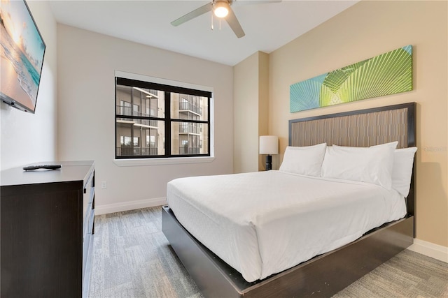 bedroom with baseboards and a ceiling fan