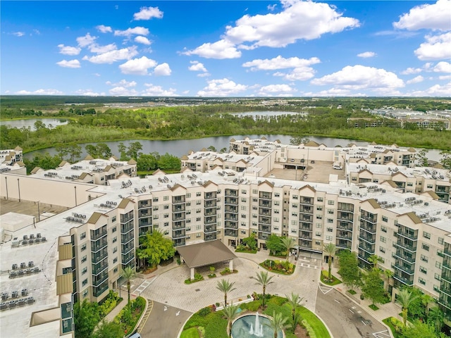 aerial view of apartment complex and a large body of water