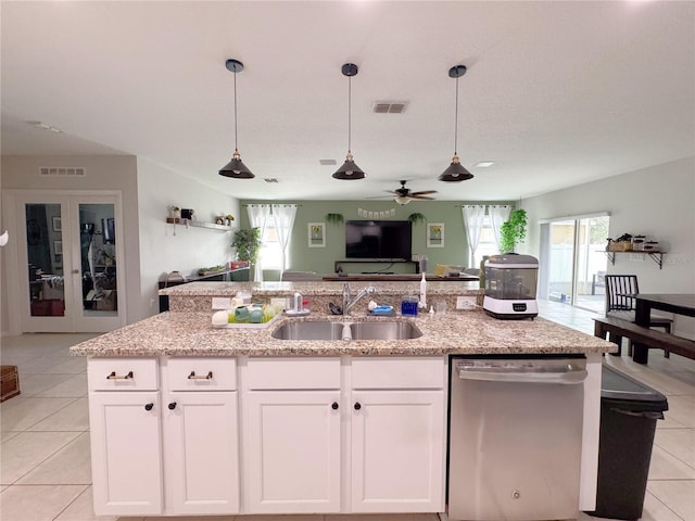 318 Briarbrook Ln, Haines City, FL 33844 - kitchen with stainless steel dishwasher, a sink, open floor plan, a ceiling fan, and hanging light fixtures
