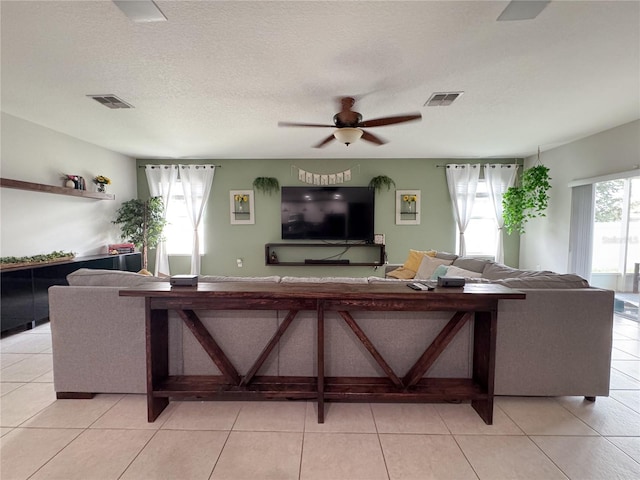 318 Briarbrook Ln, Haines City, FL 33844 - living room with a ceiling fan and light tile patterned floors