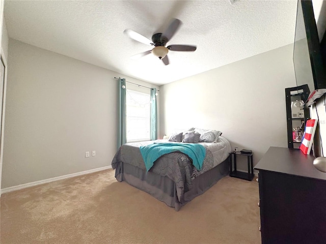 318 Briarbrook Ln, Haines City, FL 33844 - bedroom featuring light carpet, ceiling fan, baseboards, and a textured ceiling