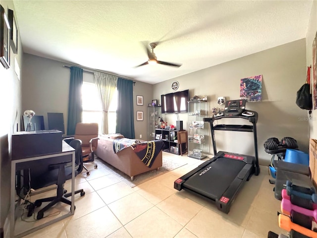 318 Briarbrook Ln, Haines City, FL 33844 - bedroom featuring light tile patterned flooring, a textured ceiling, ceiling fan, and a desk