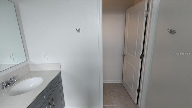 7612 Danube Rd, Kissimmee, FL 34746 - bathroom with tile patterned floors, vanity, and baseboards