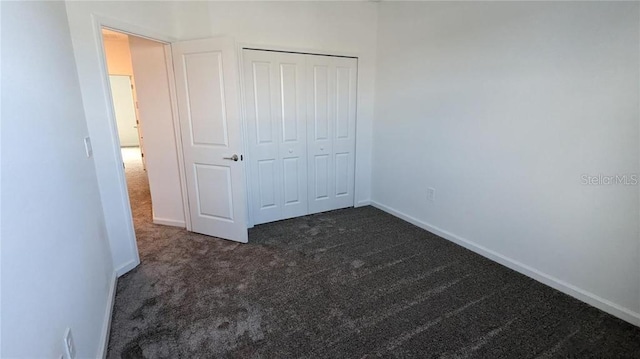 7612 Danube Rd, Kissimmee, FL 34746 - unfurnished bedroom featuring carpet flooring, baseboards, and a closet