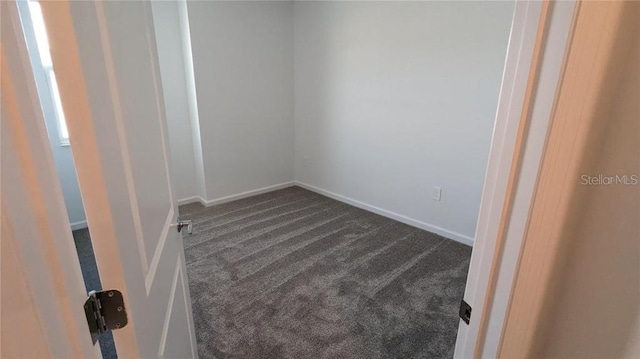 7612 Danube Rd, Kissimmee, FL 34746 - empty room with dark carpet and baseboards