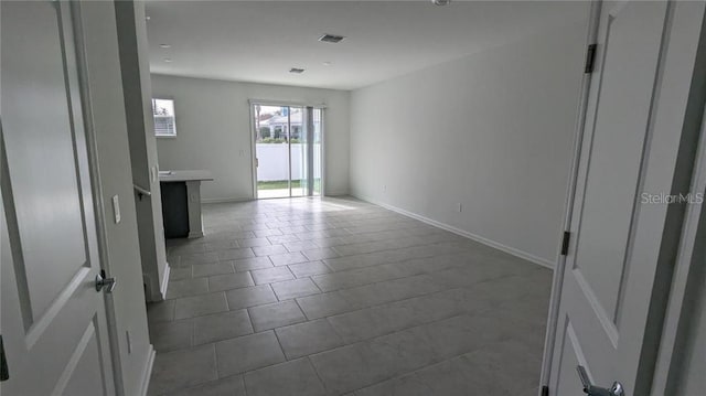 7612 Danube Rd, Kissimmee, FL 34746 - tiled empty room featuring baseboards