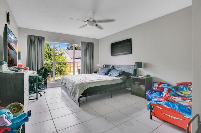 bedroom with tile patterned flooring and a ceiling fan