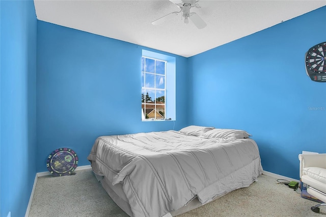 bedroom featuring baseboards, carpet floors, and ceiling fan