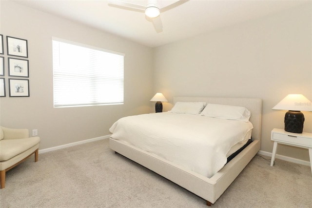 bedroom with carpet, baseboards, and a ceiling fan