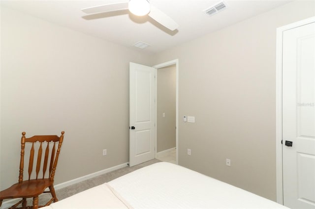 bedroom with light colored carpet, baseboards, and a ceiling fan