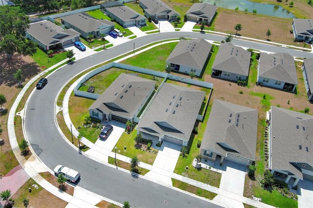 aerial perspective of suburban area featuring a large body of water
