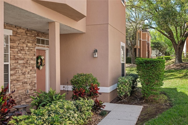 7628 Bay Port Rd Unit 43, Orlando, FL 32819 - view of exterior entry with stucco siding