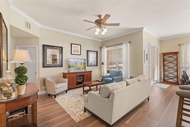 7628 Bay Port Rd Unit 43, Orlando, FL 32819 - living area with wood finished floors, ceiling fan, ornamental molding, and baseboards