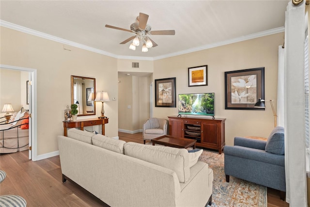 7628 Bay Port Rd Unit 43, Orlando, FL 32819 - living area with a ceiling fan, ornamental molding, baseboards, and wood finished floors